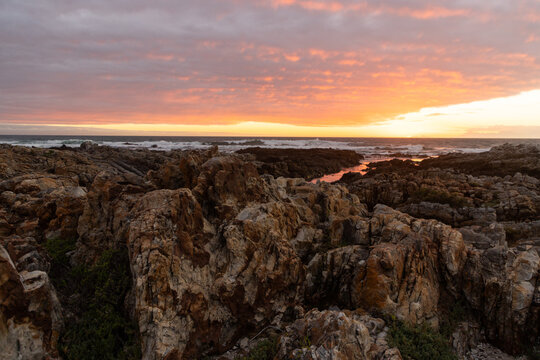 sunset light over DeKelders coastline, Gansbaai, South Africa