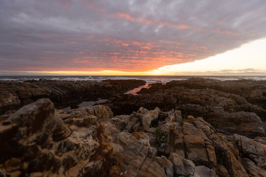 sunset light over DeKelders coastline, Gansbaai, South Africa