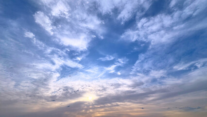 Fototapeta premium Adriatic sky over Montenegro coastline with layered clouds during golden sunset