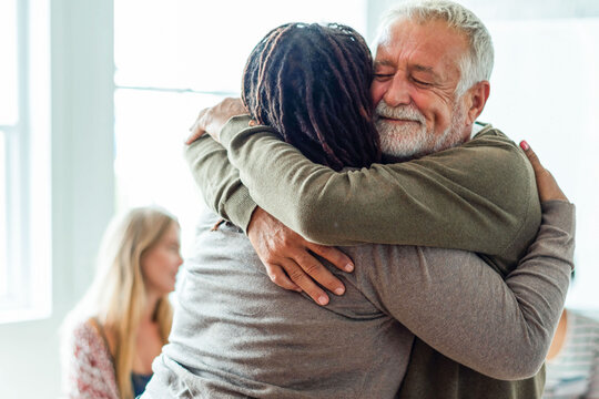Warm embrace in group setting