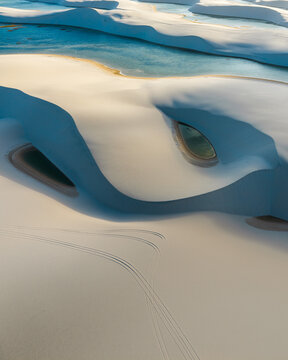 Aerial view of the white sand dunes and turquoise lagoons of Parque Nacional dos Lencois Maranhenses Lencois Maranhenses, MA, Brazil.