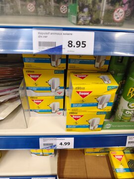 Royan, France - May 09, 2026: Action. Baygon insect repellent products displayed on a retail shelf with price tags visible in a store setting