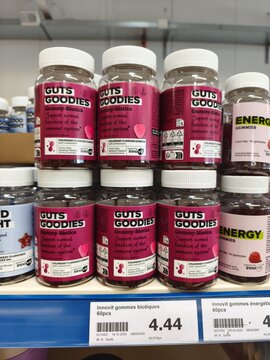 Royan, France - May 09, 2026: Action. Guts Goodies probiotic gummy vitamins displayed on a retail shelf with various other health products in the background