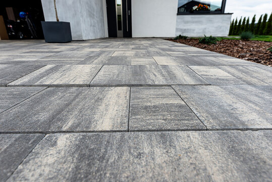 Uneven paving showing subsidence and driveway damage