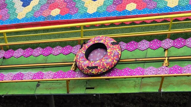 Mechanical Conveyor Belt for Rainbow Slide Dry Tubing at Outdoor Theme Park
