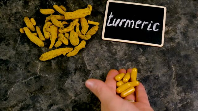 Turmeric root for supplements and essential oils. Selective focus.