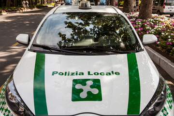 Sirmione's Polizia Locale patrol cars are distinguished by their distinctive Lombardy livery: white bodywork with bright green accents and blue roof strobes.  © Radoslaw Maciejewski