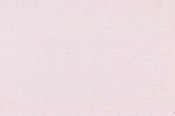 Fototapeta premium Light pink textured paper background with a soft, subtle style