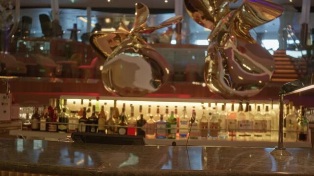 Luxury bar with blurred bokeh background and shallow focus interior; background backplate copyspace calm.