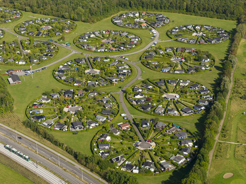 Aerial view of the unique circular garden allotments of Brondby Haveby with green hedges and small houses in Brondby, Denmark.
