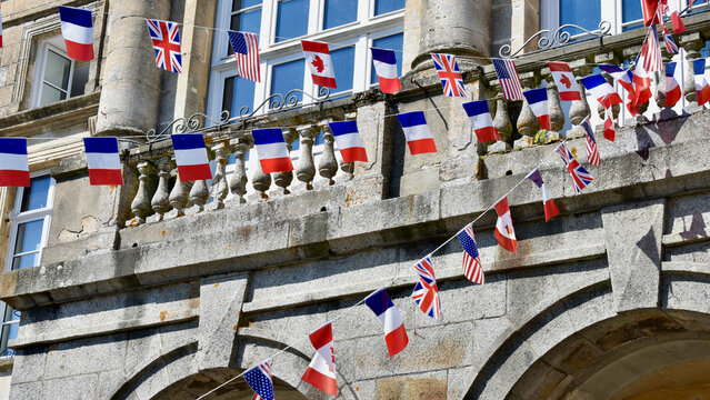 Domfront, Normandy - August 5 2024: Detail of Allied Flag Pennants on Domfront City Hall for D-Day 80th Anniversary Celebration