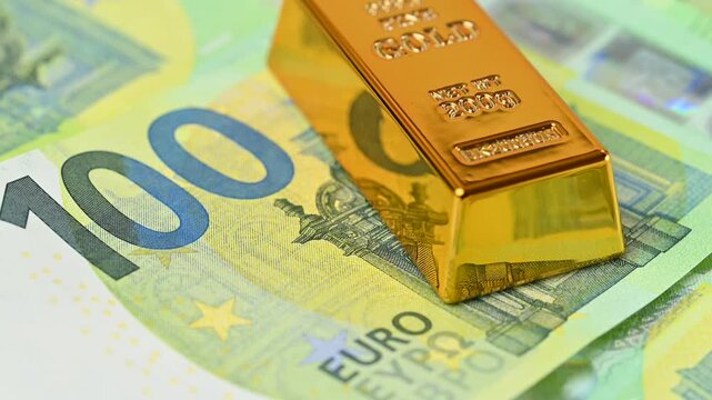 gold bars with euro bills