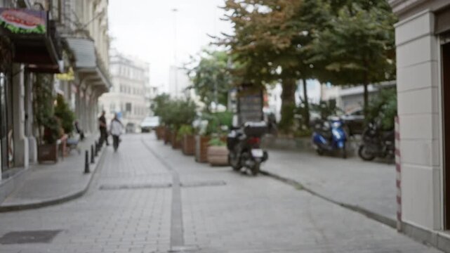 Istanbul street with soft bokeh, defocused storefronts and pavement; backplate copyspace virtual calm.