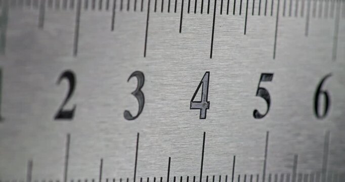 Close-up view of a metal ruler showing clear measurement markings.