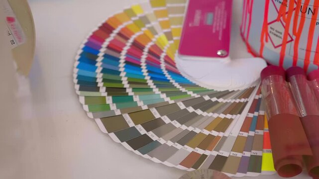 Color samples that can help you choose the exact paint you need. Closeup. Shot in motion