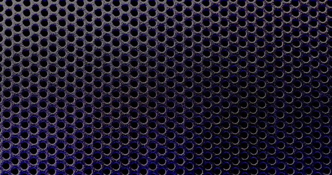 Perforated Metal Mesh. Smooth slow movement across extreme close-up of dark perforated metal grid with dramatic side lighting.	

