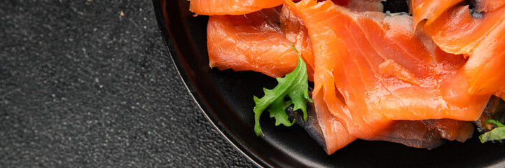 Salted salmon fresh seafood smoked red fish slices tasty snack fresh delicious gourmet food background on the table rustic food close-up copy space pescetarian diet © Alesia Berlezova