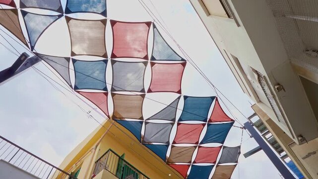 the sunshade with colored sheets in a street in Larnaka, Cyprus