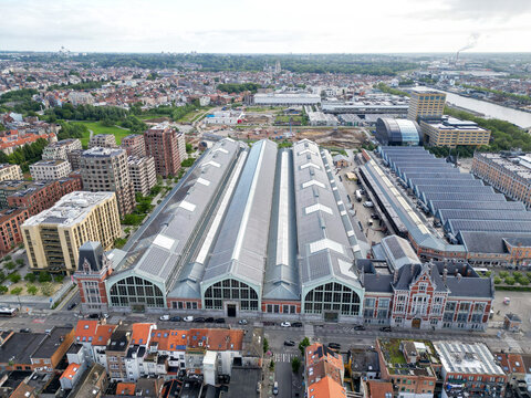 Aerial view of the Gare Maritime building at the Tour and Taxis site featuring historic industrial architecture with glass roofs and modern urban development Brussels, Brussels, Belgium.