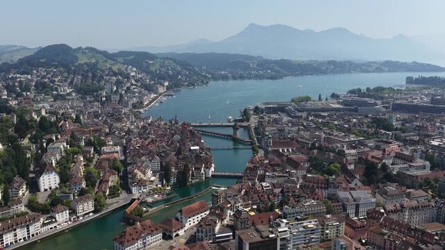 Scenic aerial view of lucerne cityscape with lake and mountains