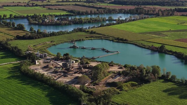 Aerial view of a gravel pit quarry and industrial lake