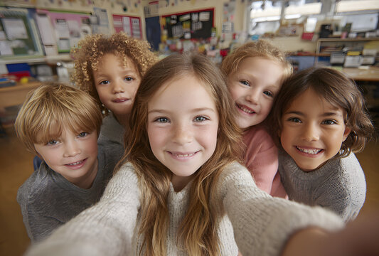 A group of kids in a co-ed school take a group selfie in an elementary school.