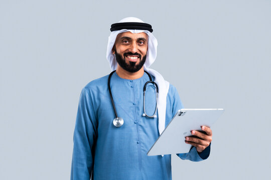 Emirati doctor holding tablet providing healthcare services