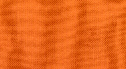 Fototapeta premium A textured background featuring a repeating pattern of small orange squares on an orange surface