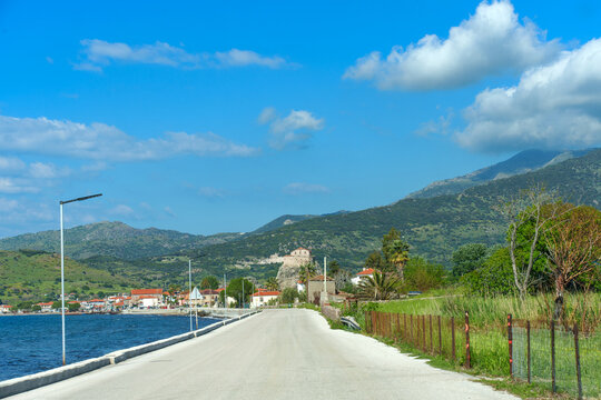 Scenic Coastal Road Heading Towards the Historic Town of Petra in Greece