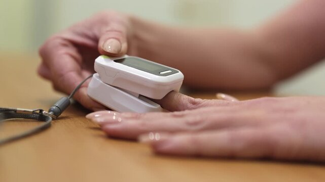 Saturation. Pulse oximeter. Blood oxygen. Slow motion video. High quality 4k footage