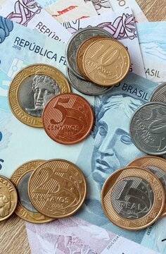 Brazilian real money bills and coins on table. Brazil cash of BRL currency