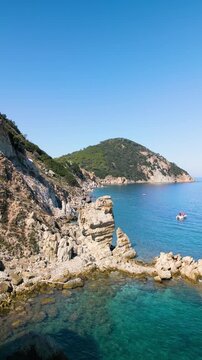 Spiaggia di Sansone Beach, Elba Island Italy &ndash; Flying Drone Reveal Over Rock Formation and Turquoise Sea