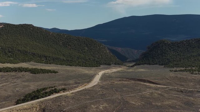 Aerial of US highway 191 in north Utah in Ashley National Forest in spring in Uinta Mountains