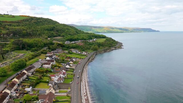 Wide 4K 60FPS aerial video of Glenarm coastal road in County Antrim, Northern Ireland in the UK. Produced in 3840x2160 and with Rec709 color.