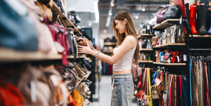 Young adult woman youth culture gen Z shopping choosing used purse bags second hand shop fast fashion lifestyles