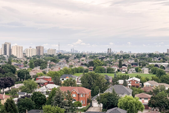 Suburban city view under cloudy sky.