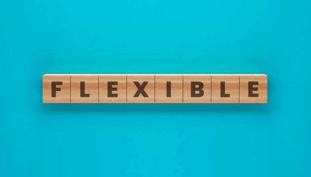 Flexible Word Block: The word Flexible is spelled out with wooden blocks on a vibrant turquoise backdrop, the image conveys adaptability and resilience.