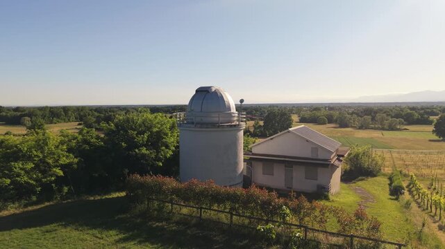Slow Aerial Pass Above Observatory and Vineyards During Sunset