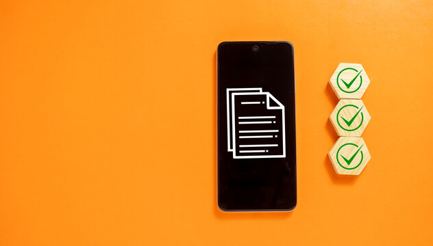 Digital Document Verification Concept with Smartphone and Checklist on Orange Background, Online Approval Process