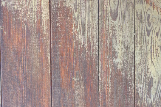 yellow brown wooden texture of pine planks in the wall of the fence