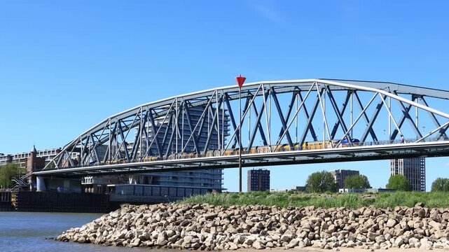 a train passing by Spoorbrug Nijmegen, blue sky