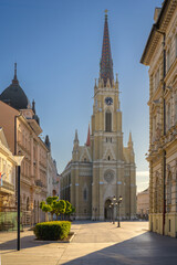 Obraz premium Novi Sad Old Town Architecture, Cathedral Spire, And Empty City Square In Serbia On A Sunny Morning
