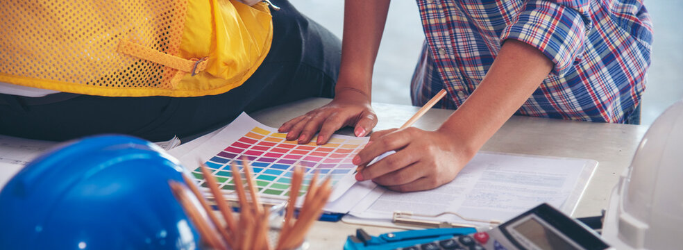 Banner Contractor construction engineer meeting on architect table at construction site. Businessman engineer manager discuss talk together foreman team builder using measure tape with copy space.