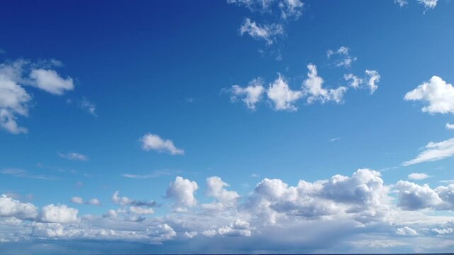 Beautiful blue sky background with light fluffy clouds and copy space, 4K aerial drone perspective, clean natural atmosphere, optimistic weather concept, serene wide-angle sky view.