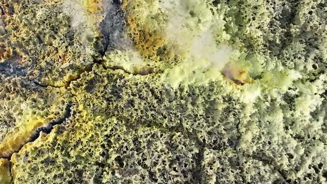 Aerial view of colorful sulfur deposits and volcanic steam in the Danakil Desert Dalol, Afar, Ethiopia.