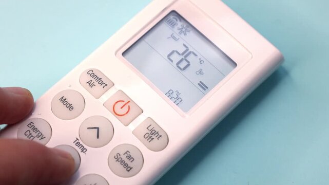 White Air Conditioner Remote Control Displaying 26 Degrees Celsius on Blue Background