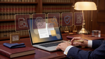 Obraz premium Legal professional using laptop with gold holographic law icons, premium office technology background for AI compliance, contract review, case research and secure document workflow