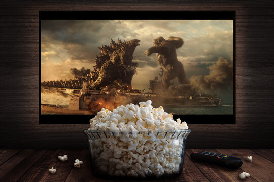 Cali, Colombia - May 15 2026: Popcorn and TV showing epic monster battle (Kong vs. Godzilla)