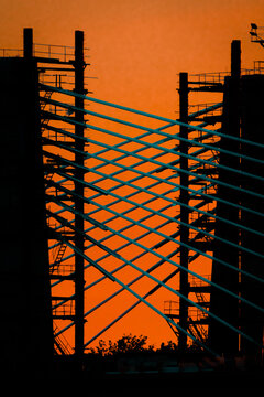 Bridge under construction over the Danube River during a beautiful sunset.