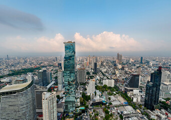 Fototapeta premium Cityscape Bangkok from aerial view, many high rise skyscrapers, panoramic view into the distance